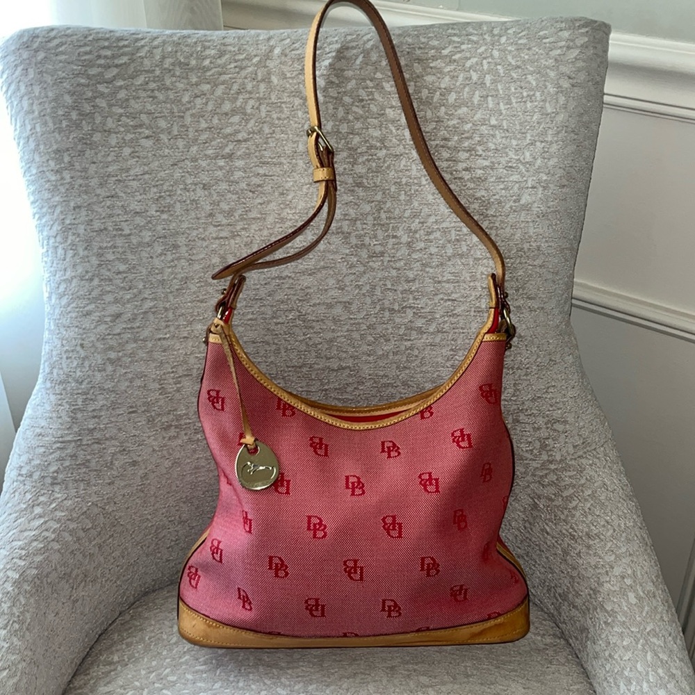 Dooney & Bourke gorgeous bag with adjustable strap.